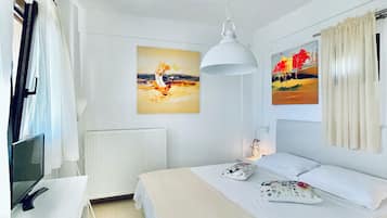 Family Room, Sea View | In-room safe, soundproofing, iron/ironing board, free WiFi