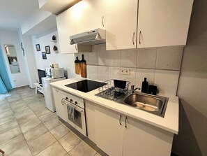 Fridge, microwave, stovetop, coffee/tea maker