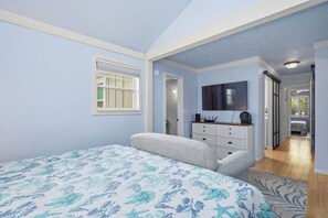 A bedroom with a bed, a dresser, a mirror, and a window. - 2 Step: Pool, Hot Tub and Dog-Friendly (Oak Island)
