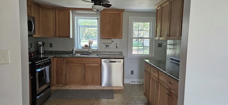 Microwave, oven, stovetop, dishwasher. Enjoyable 2-bedroom house with beautiful backyard in charming Minerva