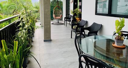 Modern 2-Bedroom Apartment in a Secure Gated Residence surrounded by trees.