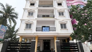 A multi-story building with a sign indicating it is a P.P. Palace. - PP Palace (Puri)