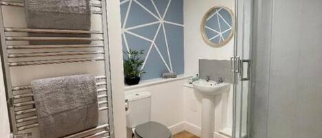 Shower, hair dryer, towels, soap