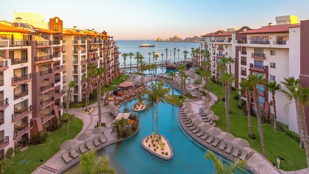 A resort with multiple buildings, a central pool area, and a view of the sea. - Villa Del Arco Luxeresort 2BDRM Oceanfront Suite,Oct 1-6 in 6ppl CABO SAN LUCAS! (Cabo San Lucas)