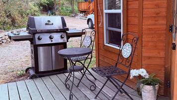 Cozy patio retreat with grill for outdoor dining