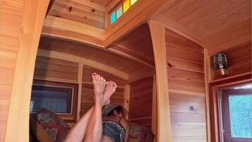 Cozy loft nook with warm wood accents and colorful skylight