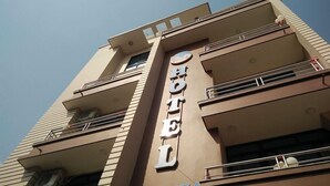 A hotel with a vertical sign reading "MARINHA" and balconies on each floor. - Hotel Marinha Pvt. Ltd (Kathmandu)