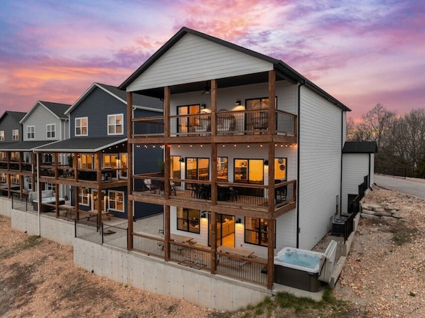 A multi-story building with balconies, a hot tub, and a pool. - Stunning view-Hot Tub-Game Room-Indoor Pool Access (Branson)