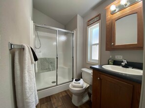 Shower, hair dryer, towels, soap