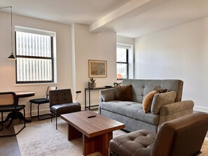 TV, books - Luxury Downtown Apt with Parking, Gym, and Lap Pool (Milwaukee)