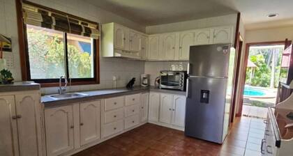 Riverside oasis with private pool and backyard. Walking distance to the beach.