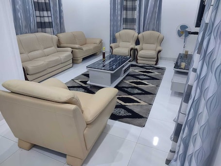 Living area. Furnished two-bedroom apartment in downtown Tambacounda