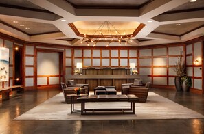 A spacious lobby with a central seating area, a reception desk, and a modern chandelier. - The Ritz-Carlton, Vail-Charming 2BRM/2.5BATH Mountain Suite With Balcony (Vail)