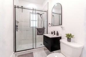 Shower, hair dryer, towels, soap