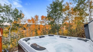 A hot tub with a view of autumn trees. - Moose Mountain Lodge Above Park City (Summit County)