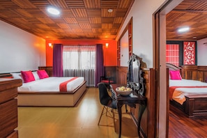 A hotel room with two beds, a wooden ceiling, a dining table with chairs, and a mirror. - Spacious 8-Bedroom Villa in fabulous Krong Siem Reap with Private Pool (Krong Siem Reap)