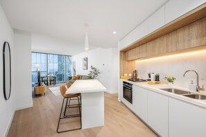 Fridge, microwave, oven, stovetop - Sky-High 2BR Apartment | Pool & Sauna | Near Marvel Stadium (Melbourne)