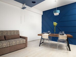 Design Apartment, Balcony, City View | Living area | 50-inch flat-screen TV with digital channels - Blue Holiday (Meta)