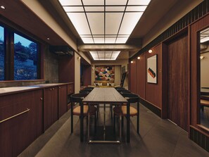 A modern kitchen with a long dining table, wooden cabinets, and a large window. - illi Toas Tokyo-Toranomon (Tokyo)