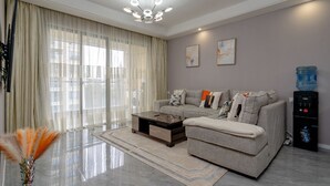 Apartment, 1 King Bed, Kitchen, Pool View | Living area - Alba Gardens B1102 (Nairobi)