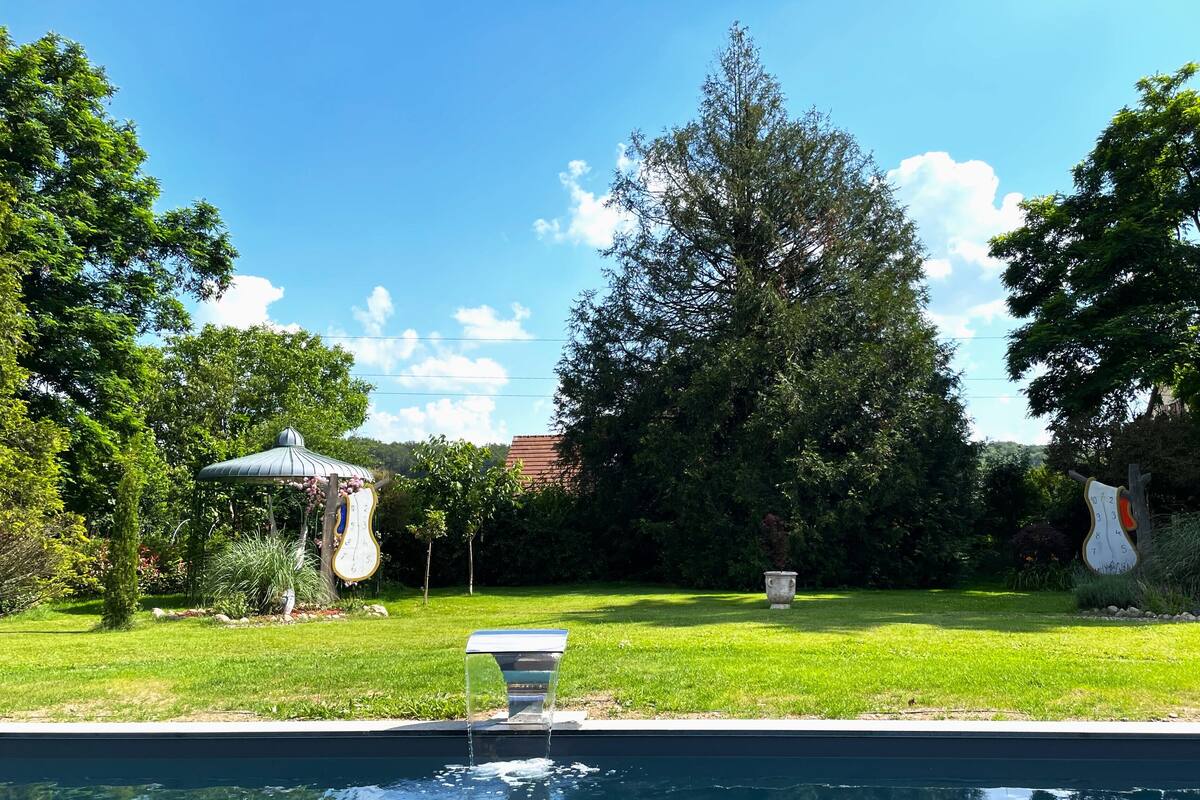 Family Room, Balcony, Garden View | Blackout drapes, iron/ironing board, free WiFi