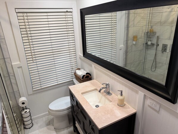 Shower, hair dryer, towels, soap