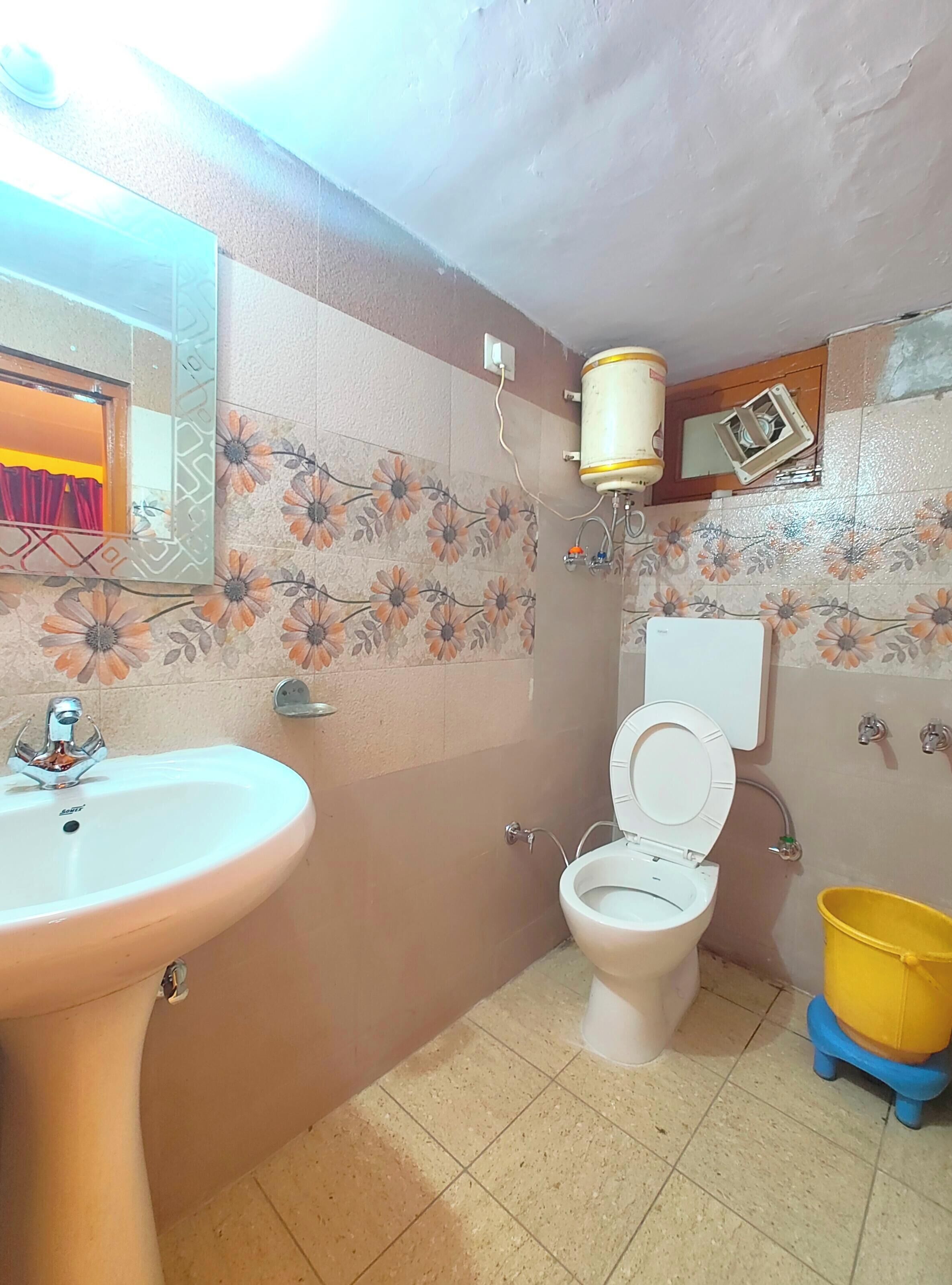Shower, rainfall showerhead, slippers, towels