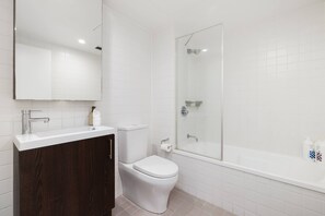 Shower, hair dryer, towels, shampoo