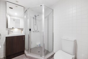 Shower, hair dryer, towels, shampoo