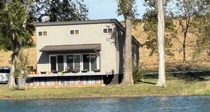 Cozy pond house nestled in nature waiting for you to enjoy