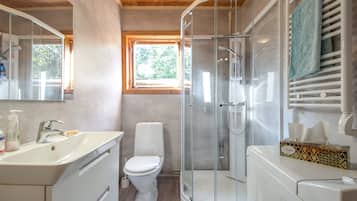 Shower, hair dryer, soap, toilet paper