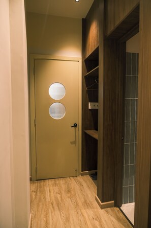 Desk, laptop workspace, blackout drapes, iron/ironing board