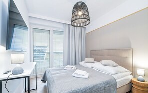 Apartamento conforto (E412) | Ferros/tábuas de passar roupa, Wi-Fi de cortesia, roupa de cama