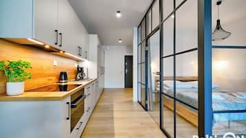 Studio Suite, 1 Queen Bed with Sofa bed, Kitchenette (D111) | Private kitchen | Full-size fridge, oven, stovetop, dishwasher