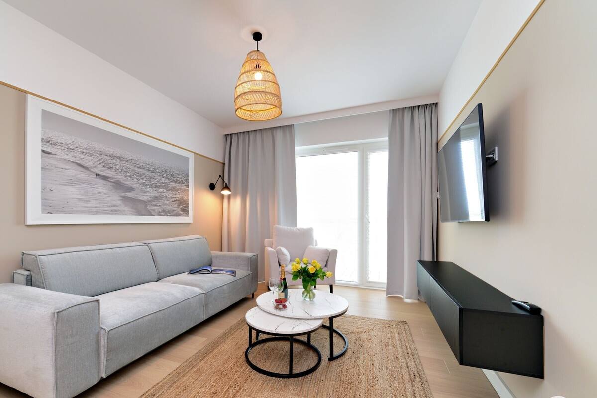 Classic Apartment, Pool View (C310) | Living area | 40-inch Smart TV with digital channels