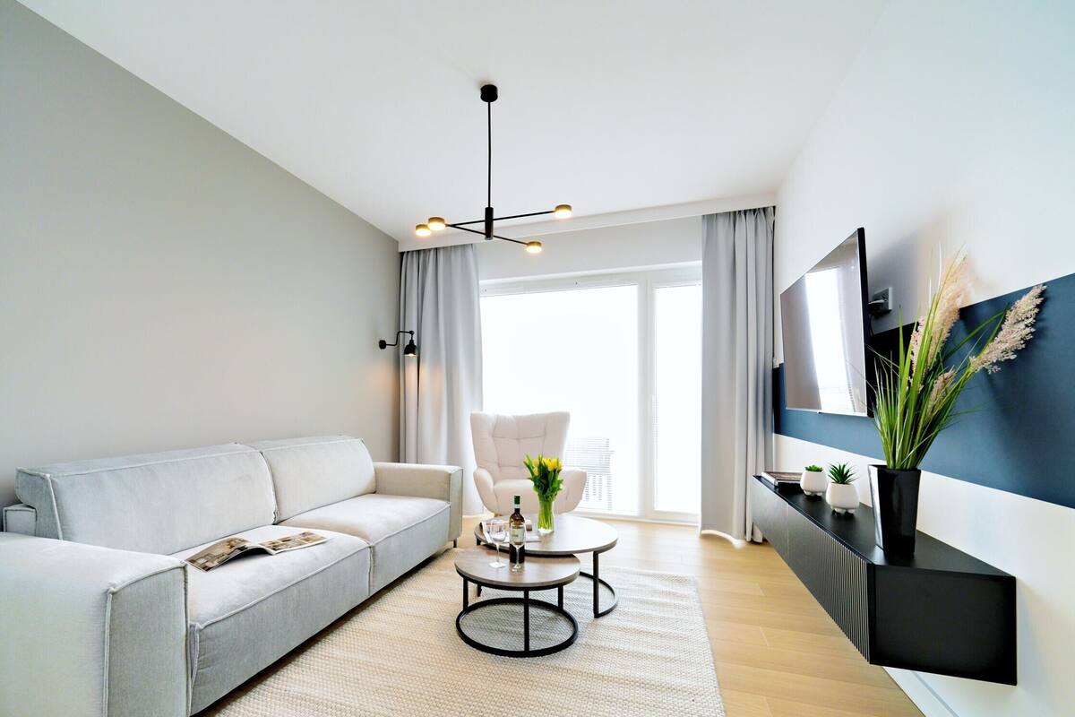 Classic Apartment, Pool View (C310) | Living area | 40-inch Smart TV with digital channels