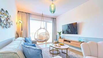Classic Apartment, Courtyard View (B414) | Living area | 40-inch Smart TV with digital channels