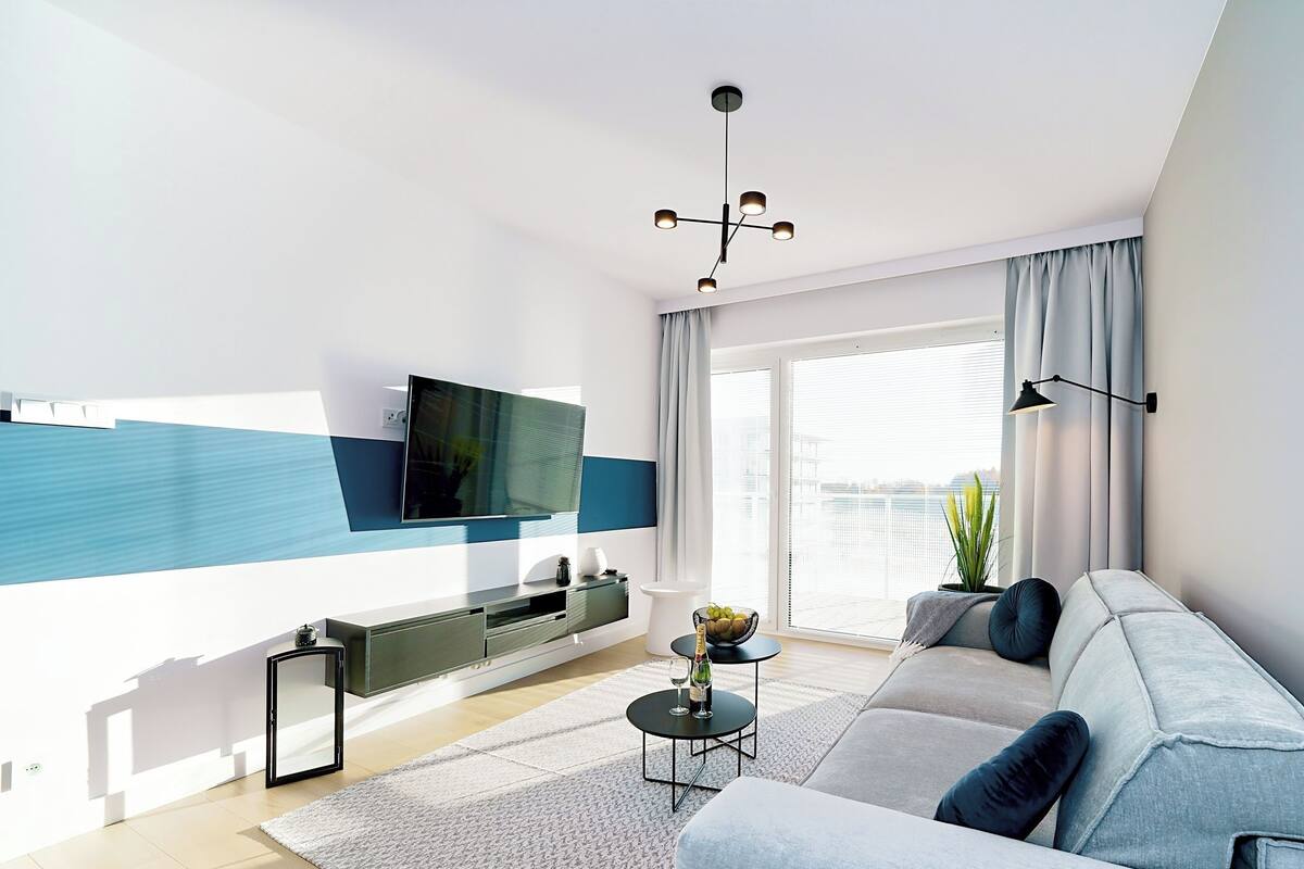 Classic Apartment, Pool View (A308) | Living area | 40-inch Smart TV with digital channels