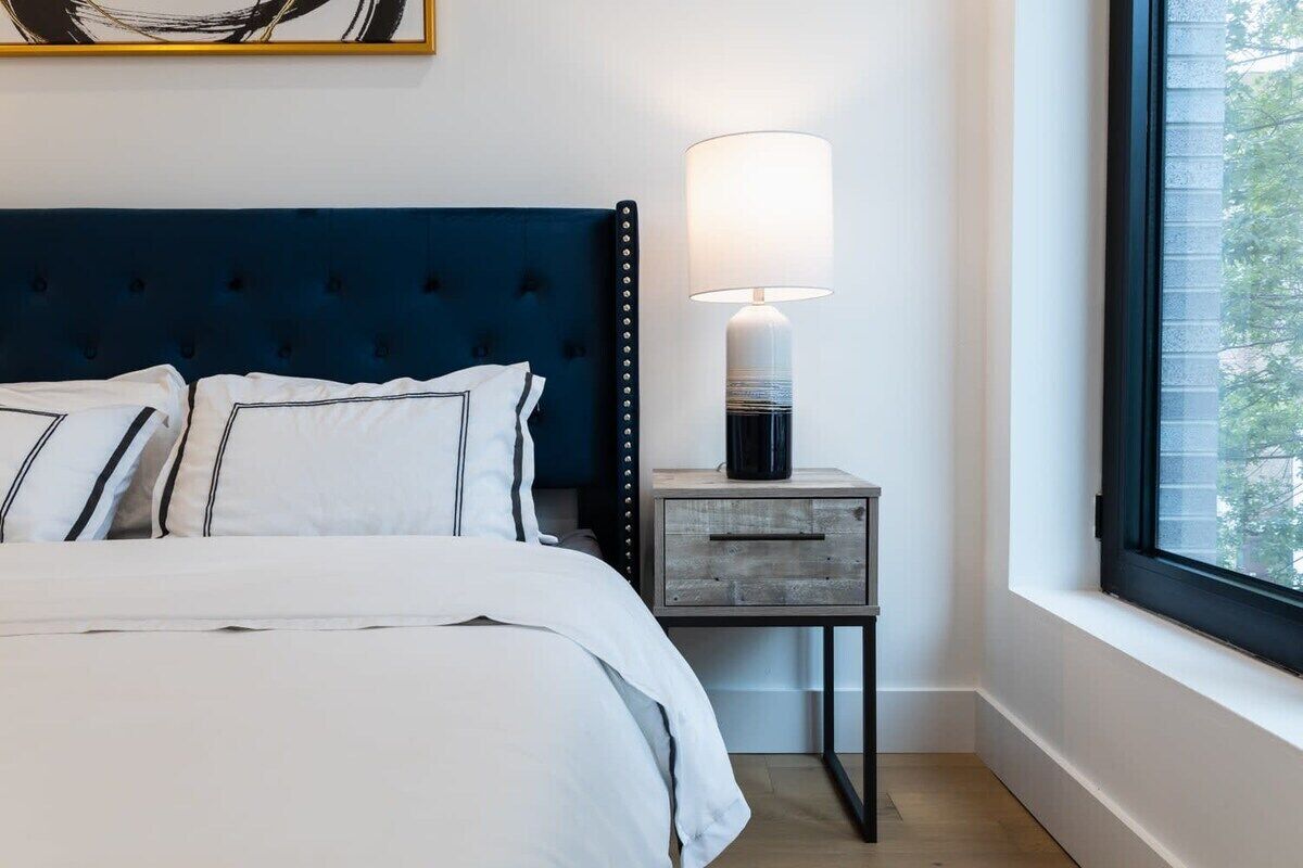 Desk, laptop workspace, blackout drapes, iron/ironing board