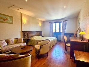 Suite, Balcony, Garden View | In-room safe, soundproofing, iron/ironing board, wheelchair access