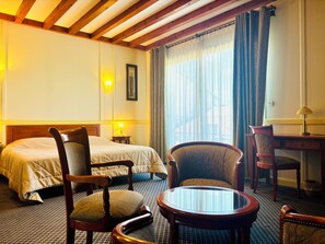 Suite, Balcony, Garden View | In-room safe, soundproofing, iron/ironing board, wheelchair access