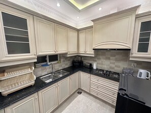 Fridge, microwave, stovetop, coffee/tea maker - 3 Bed House In DHA Phase 9 Town Lahore 5 minutes to Dolmen Mall Lahore (Lahore)