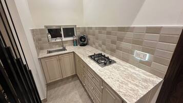 Fridge, microwave, stovetop, coffee/tea maker