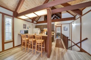 A kitchen with wooden bar stools, a refrigerator, and a microwave. - Incline Village Condo 2 Fl 3 Bdrm/ 7 Guests  2 Car Permits (Incline Village)