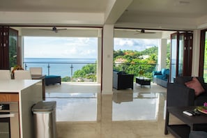 Luxury Apartment, Balcony, Sea View | In-room safe, blackout drapes, soundproofing, iron/ironing board - Villa Vino Lucia & Helen's Wine Cellar (Marigot Bay)