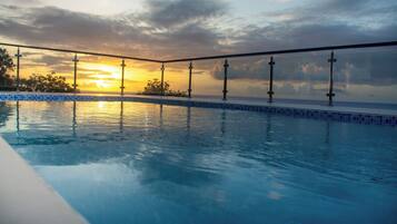 Outdoor pool, open 7:00 AM to 5:00 PM, pool umbrellas, sun loungers