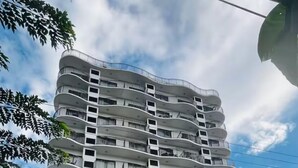 A multi-story hotel named 'Horizon' with a modern design, featuring balconies on each floor and a ground-level entrance. - A spacious Studio apartment / condo near Clark Airport angeles city pampanga (Angeles)
