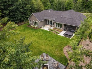 A two-story house with a covered patio and a well-maintained lawn. - SOMETHING FOR EVERYONE,  New 3+ BR, 4 Bath, Ranch, Game Rm, Fenced Yd & Pond (Fennville)