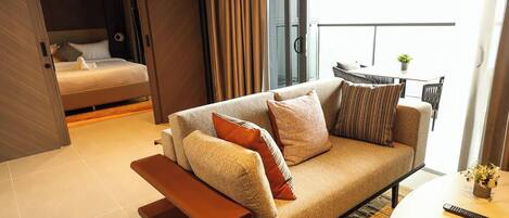 Honeymoon Studio Suite, 1 King Bed | Living area | 65-inch Smart TV with premium channels