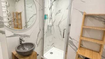 Shower, hair dryer, towels, soap